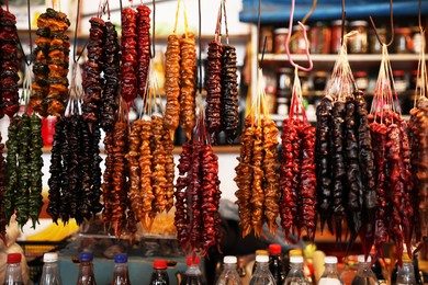 Bunches of different delicious churchkhelas at market