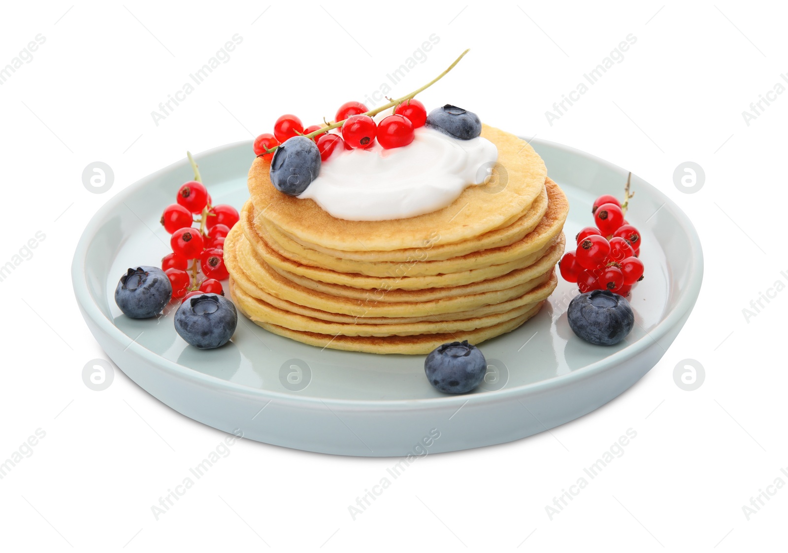 Photo of Tasty pancakes with natural yogurt, blueberries and red currants on white background