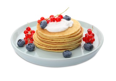 Photo of Tasty pancakes with natural yogurt, blueberries and red currants on white background