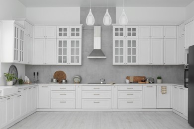 Beautiful kitchen interior with stylish modern furniture