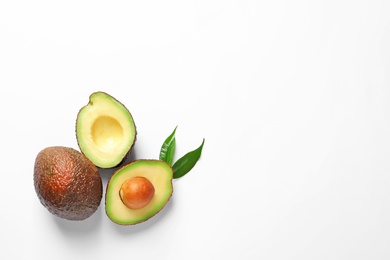 Composition with ripe fresh avocados on white background