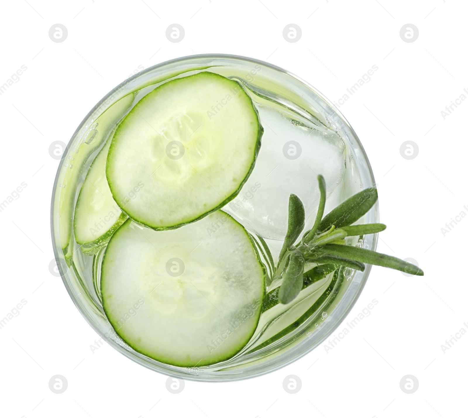 Photo of Glass of refreshing cucumber lemonade and rosemary on white background, top view. Summer drink