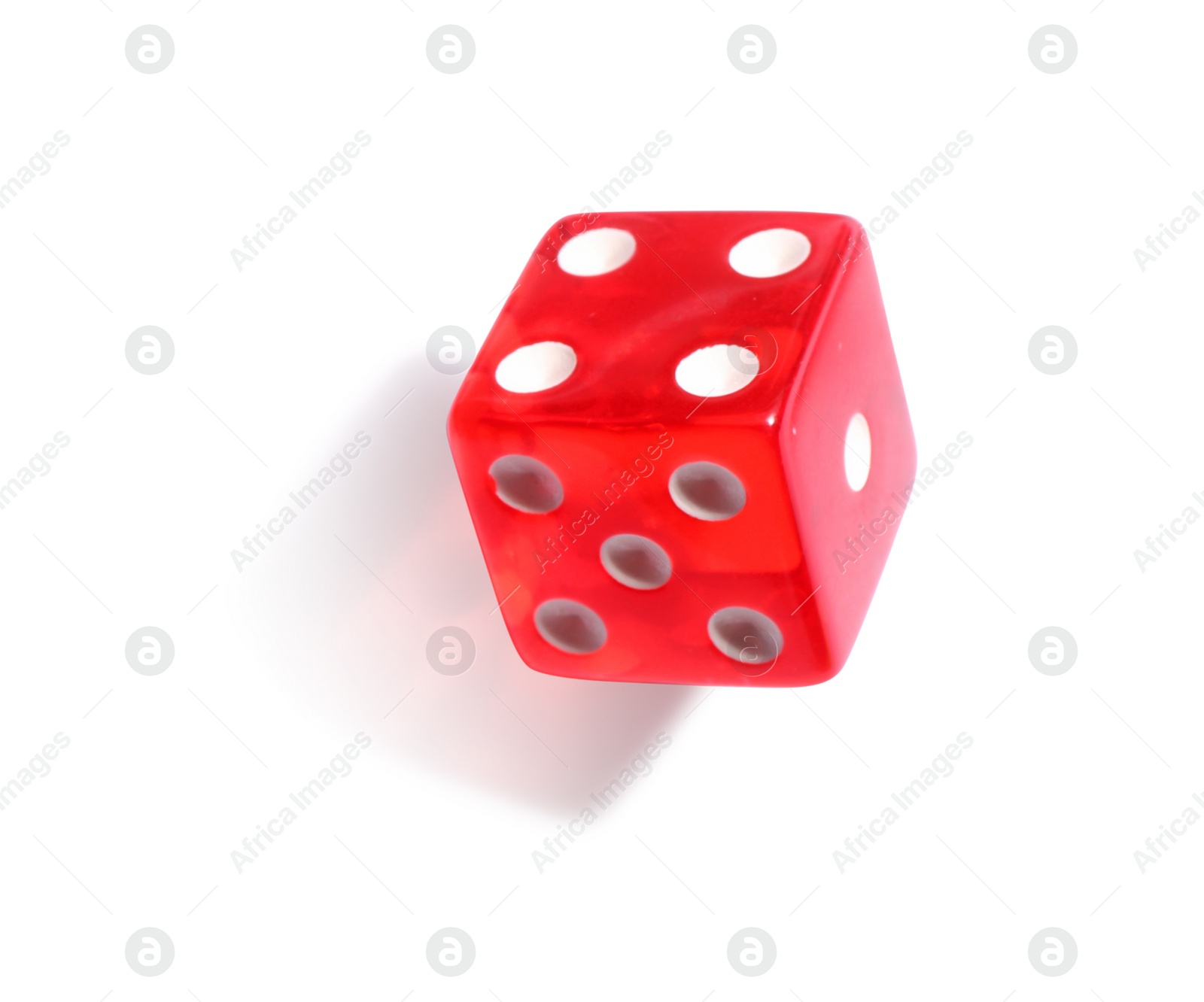 Photo of One red game dice isolated on white