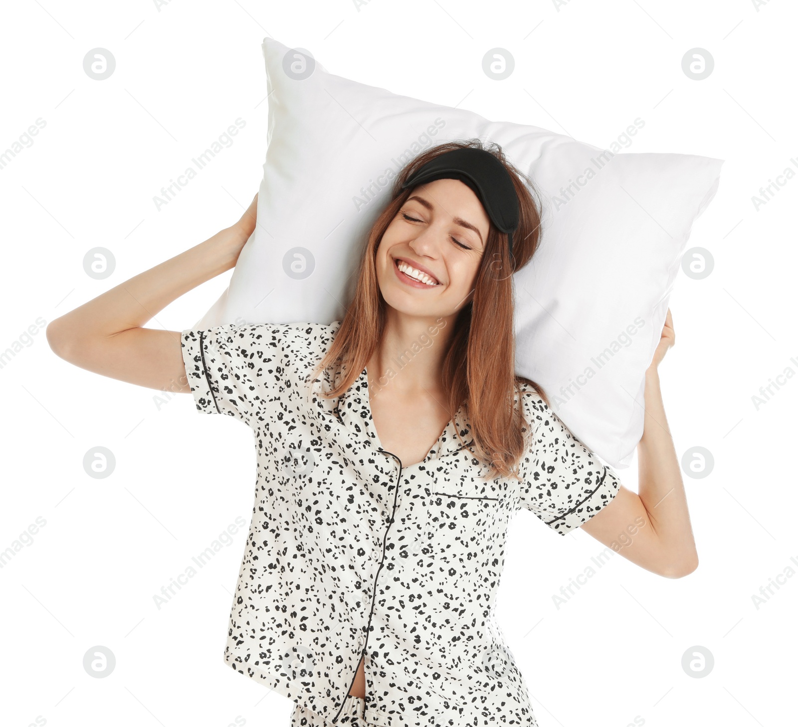 Photo of Beautiful woman with pillow and sleep mask on white background. Bedtime