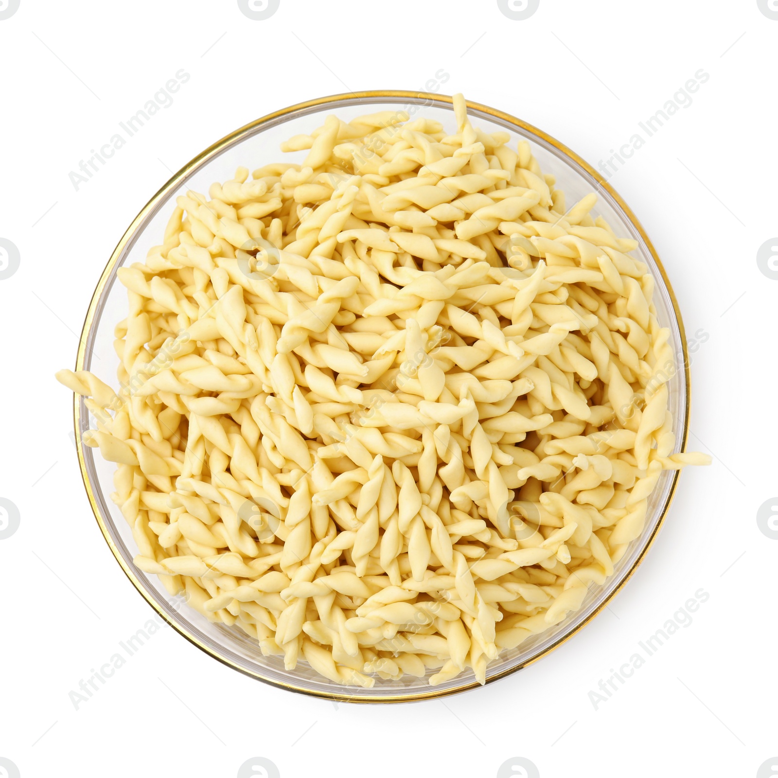 Photo of Uncooked trofie pasta in bowl isolated on white, top view