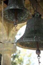 Photo of Closeup view of old bells in tower