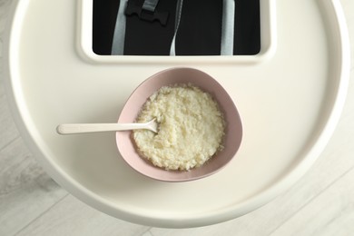 Baby high chair with healthy food, top view