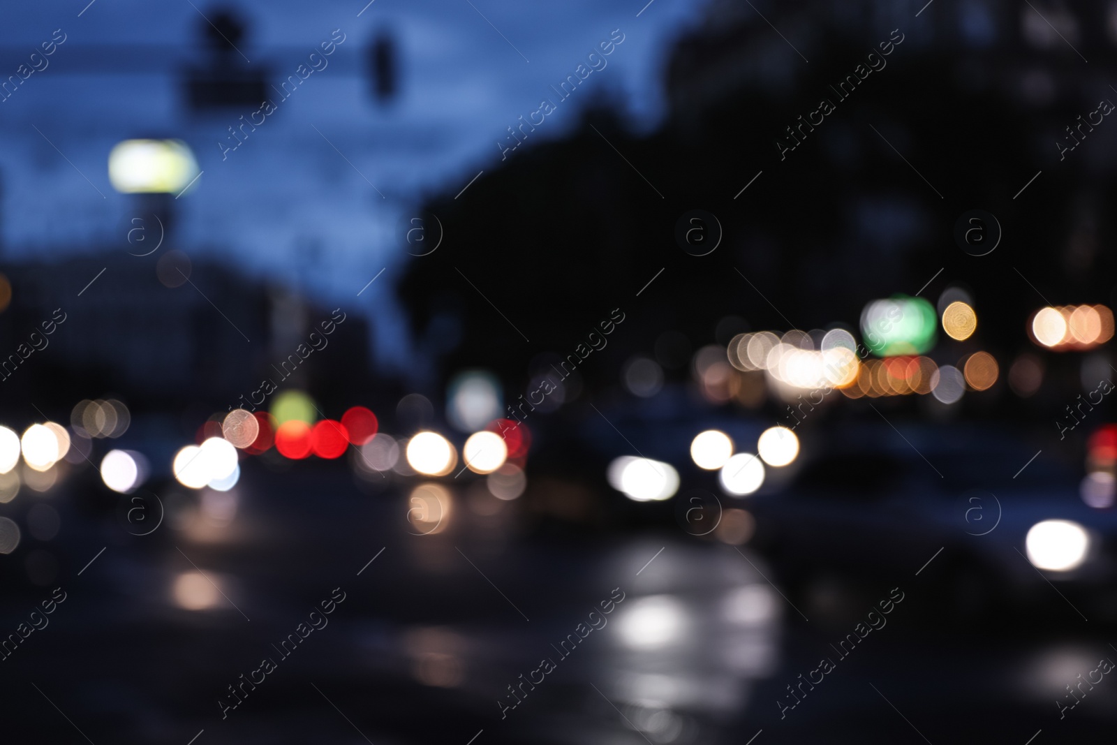 Photo of Blurred view of modern city at evening. Bokeh effect