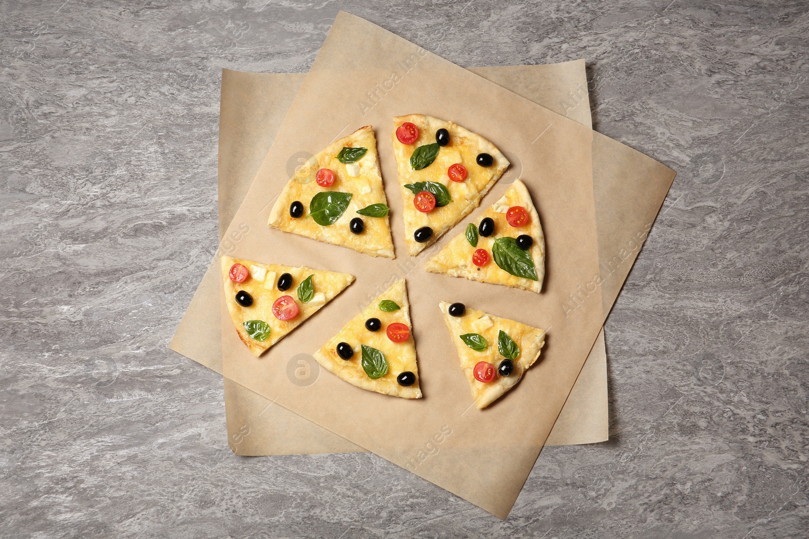 Photo of Flat lay composition with slices of tasty homemade pizza on table