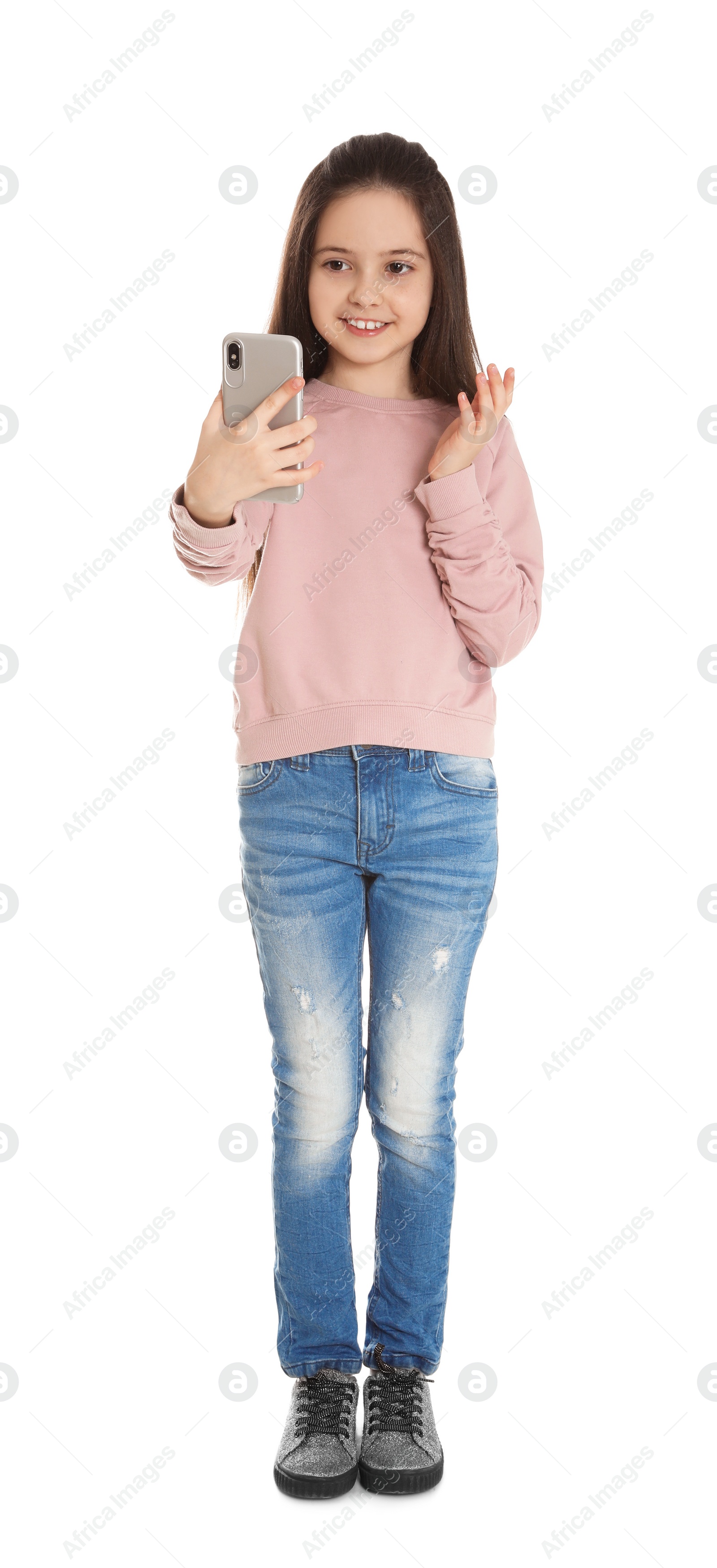 Photo of Little girl using video chat on smartphone, white background