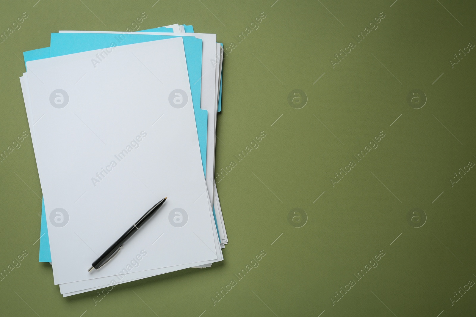 Photo of Turquoise files with blank sheets of paper and pen on olive background, top view. Space for text