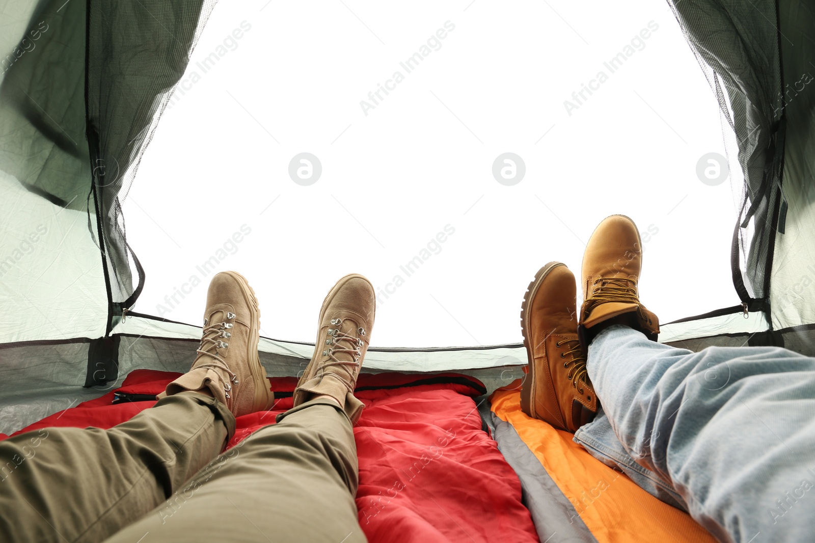 Photo of Closeup of couple in camping tent on white background, view from inside