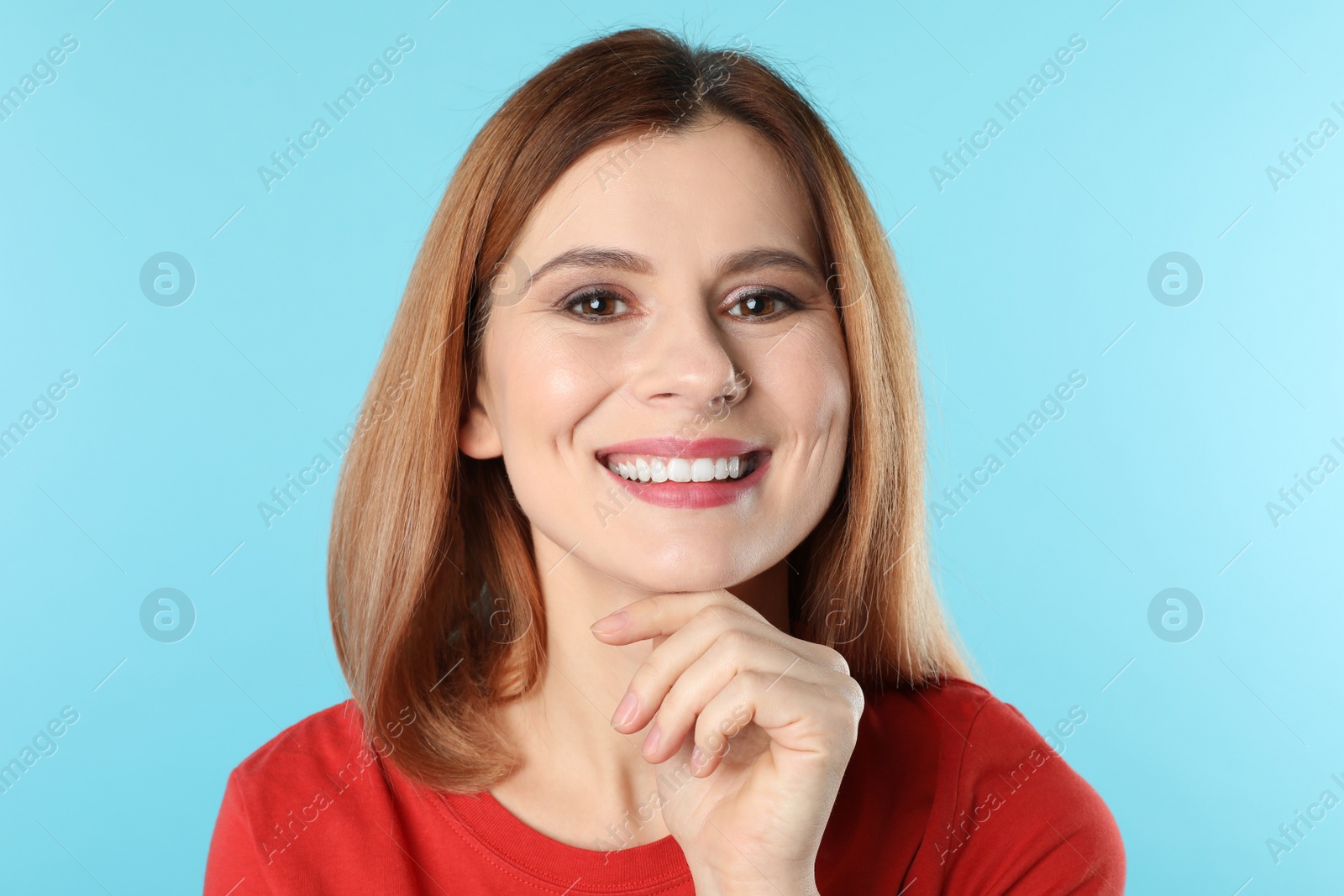 Photo of Smiling woman with perfect teeth on color background