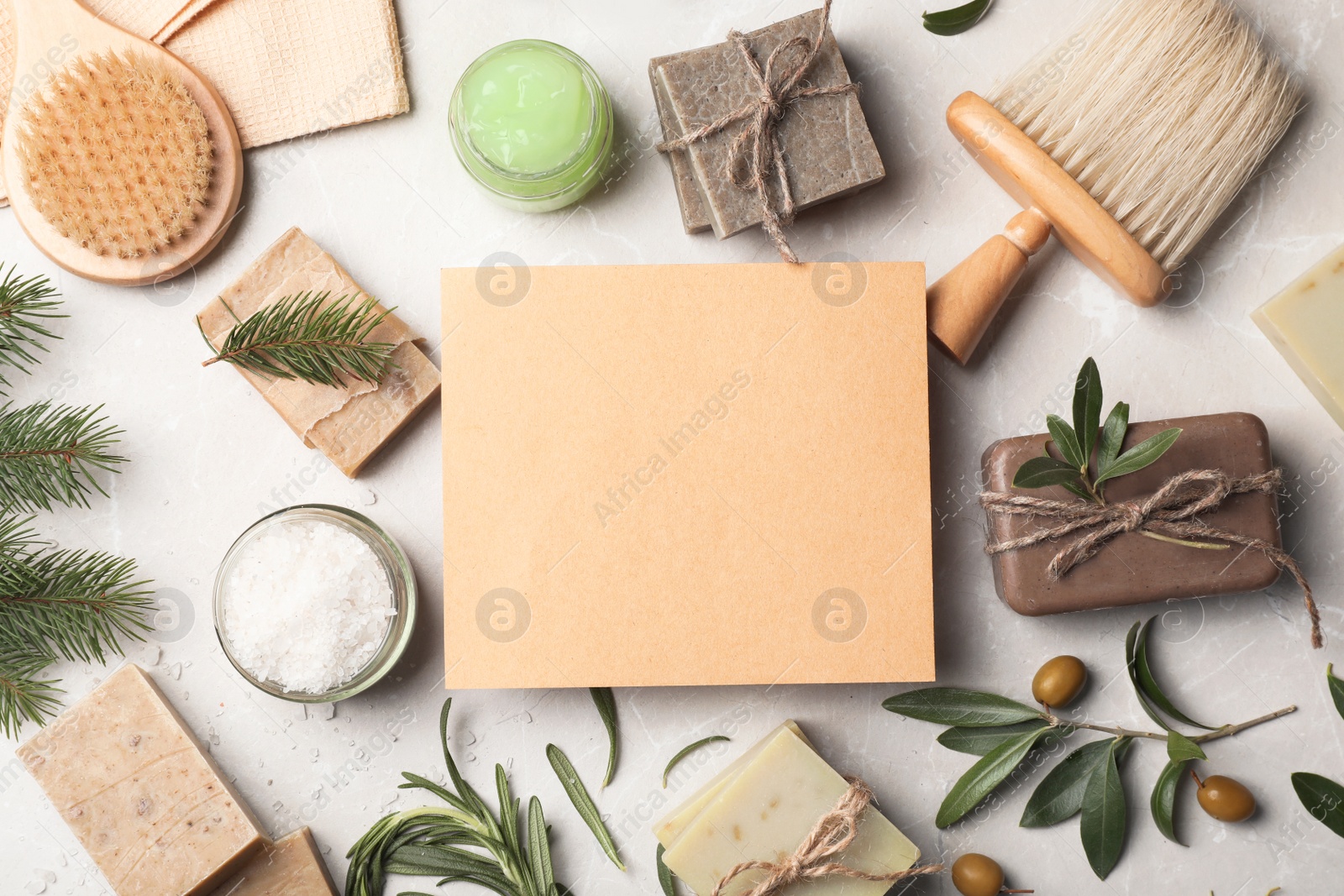 Photo of Flat lay composition with different soap bars and blank card on light background. Space for text