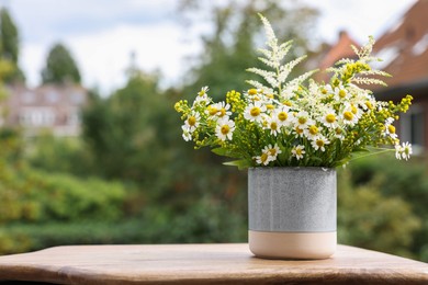 Photo of Bouquet of fresh flowers outdoors. Space for text