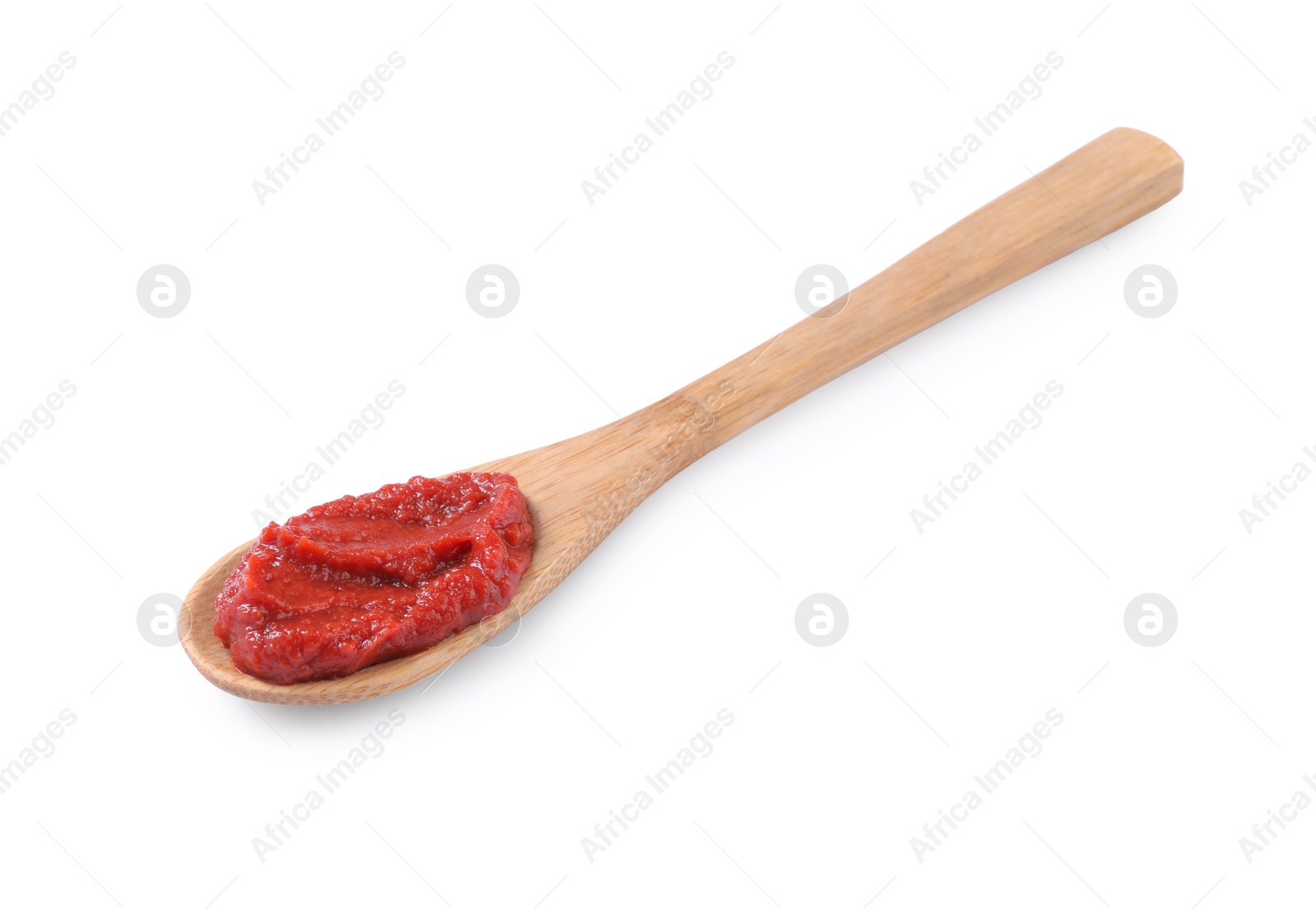 Photo of Wooden spoon of tasty tomato paste isolated on white