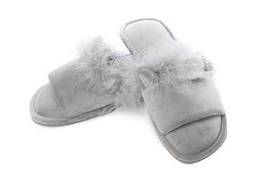 Photo of Pair of soft slippers with fur isolated on white