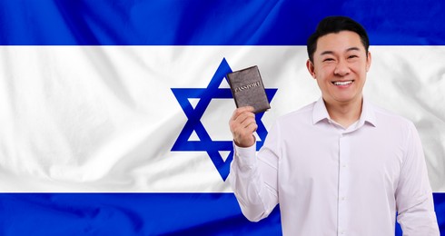 Immigration. Happy man with passport against national flag of Israel, space for text. Banner design