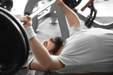 Photo of Overweight man training in gym