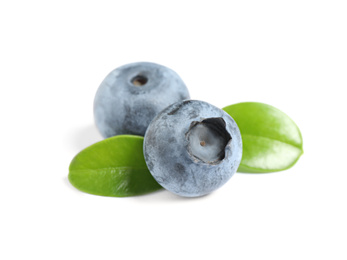 Photo of Fresh ripe blueberries with leaves on white background