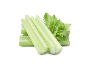 Fresh cut celery stalks and leaves on white background