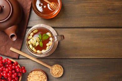 Flat lay composition with immunity boosting drink on wooden table. Space for text