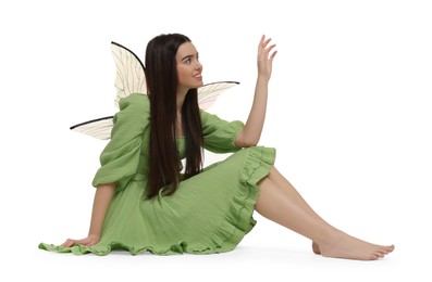 Photo of Beautiful girl in fairy costume with wings on white background