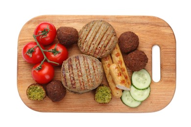 Serving board with different delicious vegan meat products and fresh vegetables isolated on white, top view