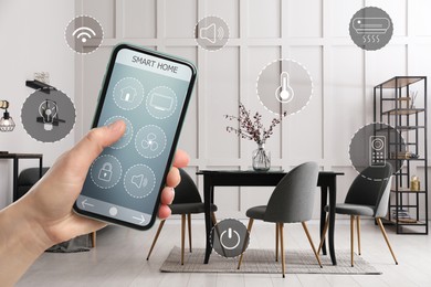 Image of Woman using smart home control system via application on mobile phone indoors, closeup. Different icons around