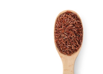 Wooden spoon with brown rice on white background, top view