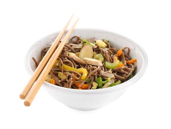 Photo of Stir-fry. Delicious cooked noodles with chicken in bowl and chopsticks isolated on white