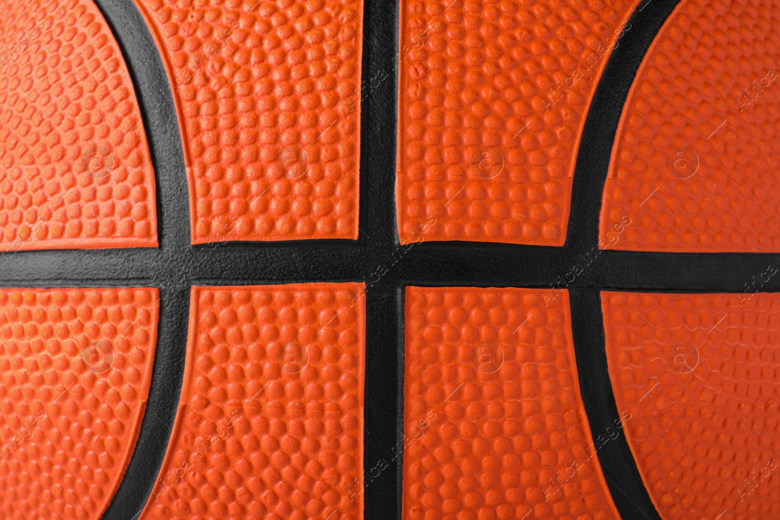 Photo of Orange ball as background, closeup. Basketball equipment