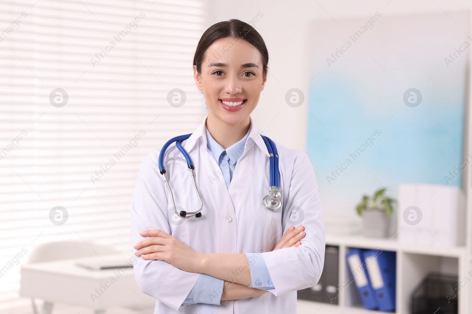 Photo of Portrait of medical consultant with stethoscope in clinic