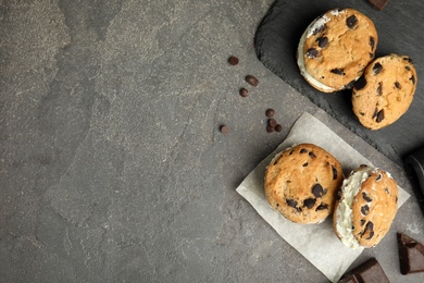 Photo of Sweet delicious ice cream cookie sandwiches served on table, flat lay. Space for text