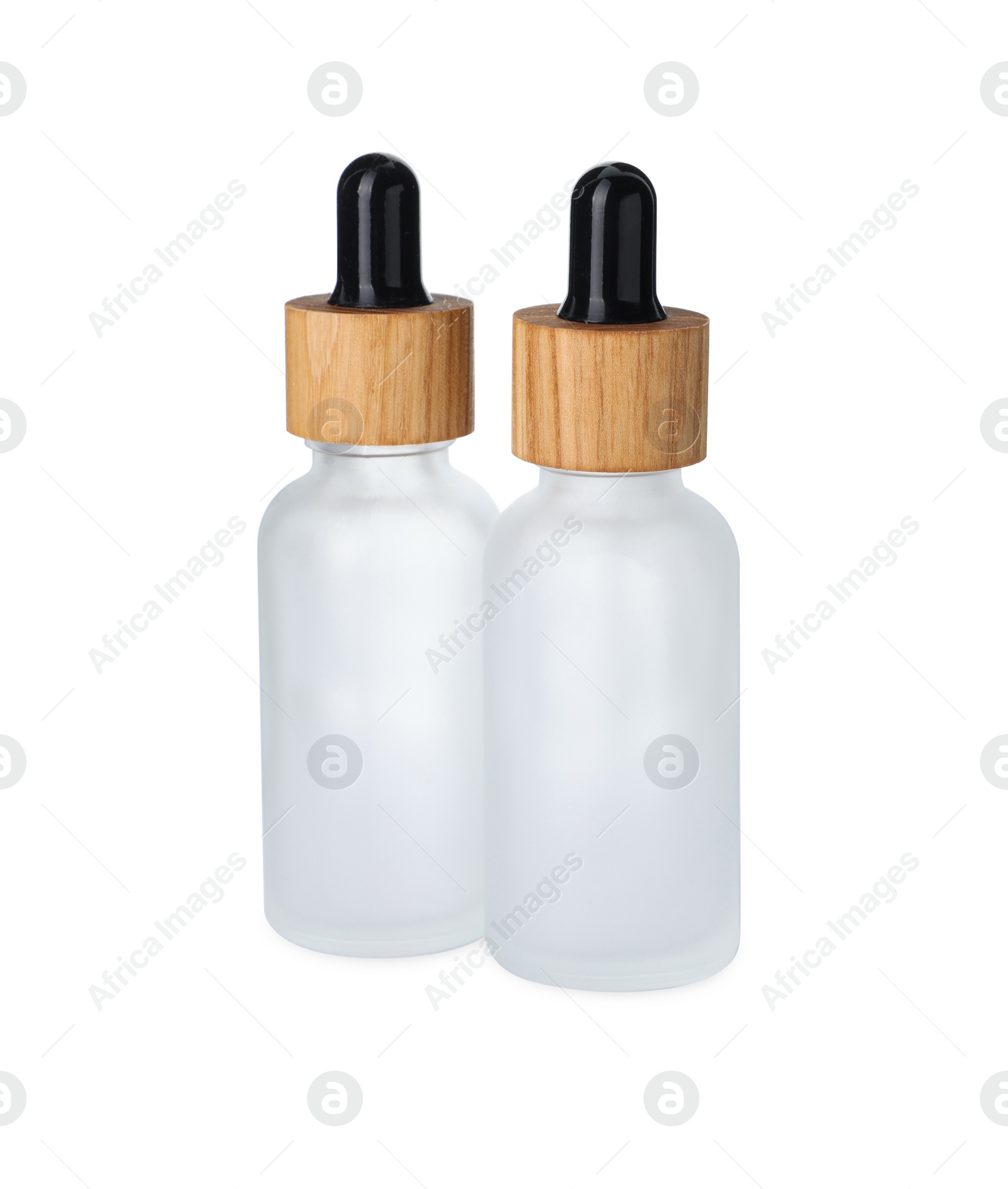 Photo of New empty glass bottles with droppers isolated on white