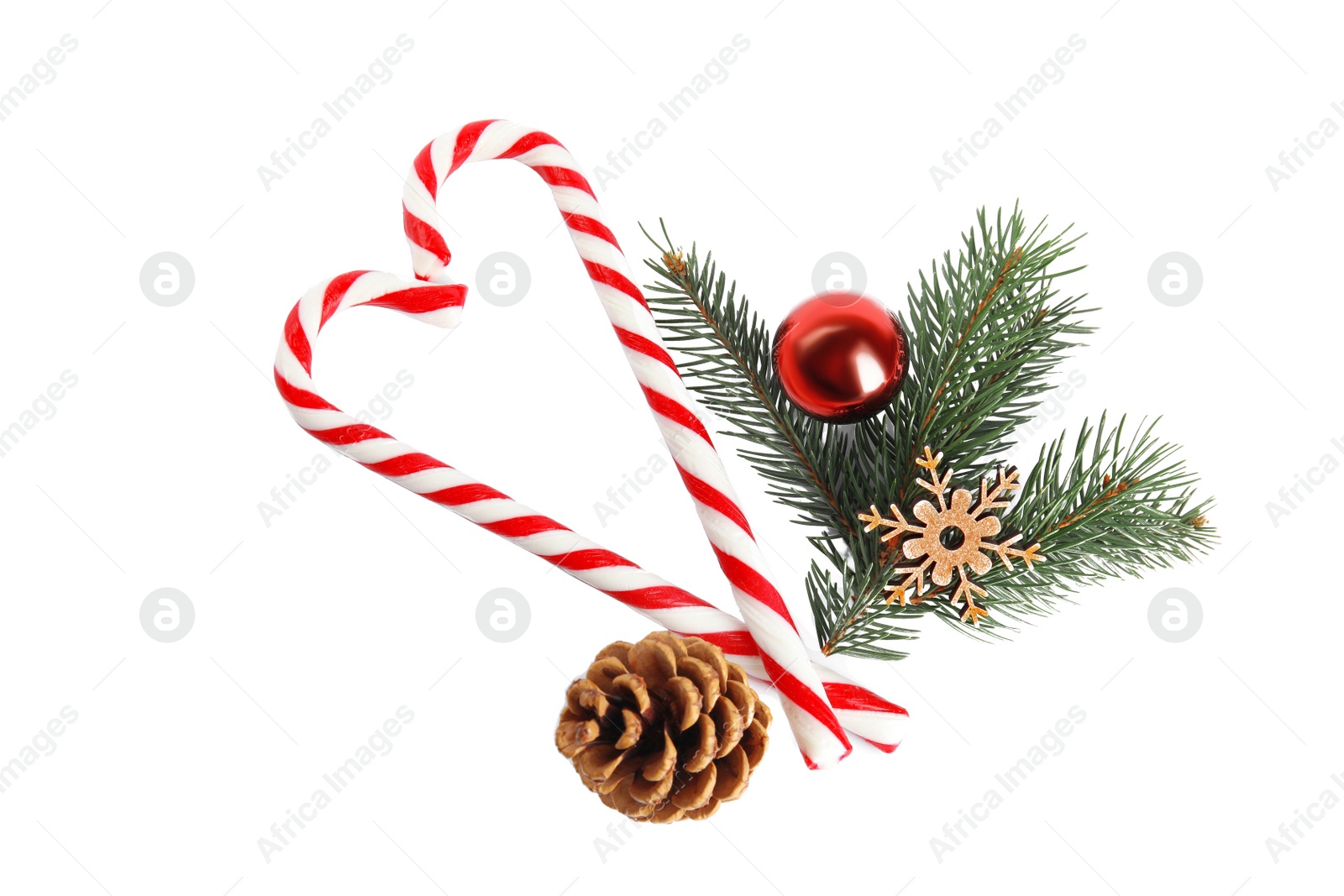 Photo of Candy canes and Christmas decorations on white background, top view