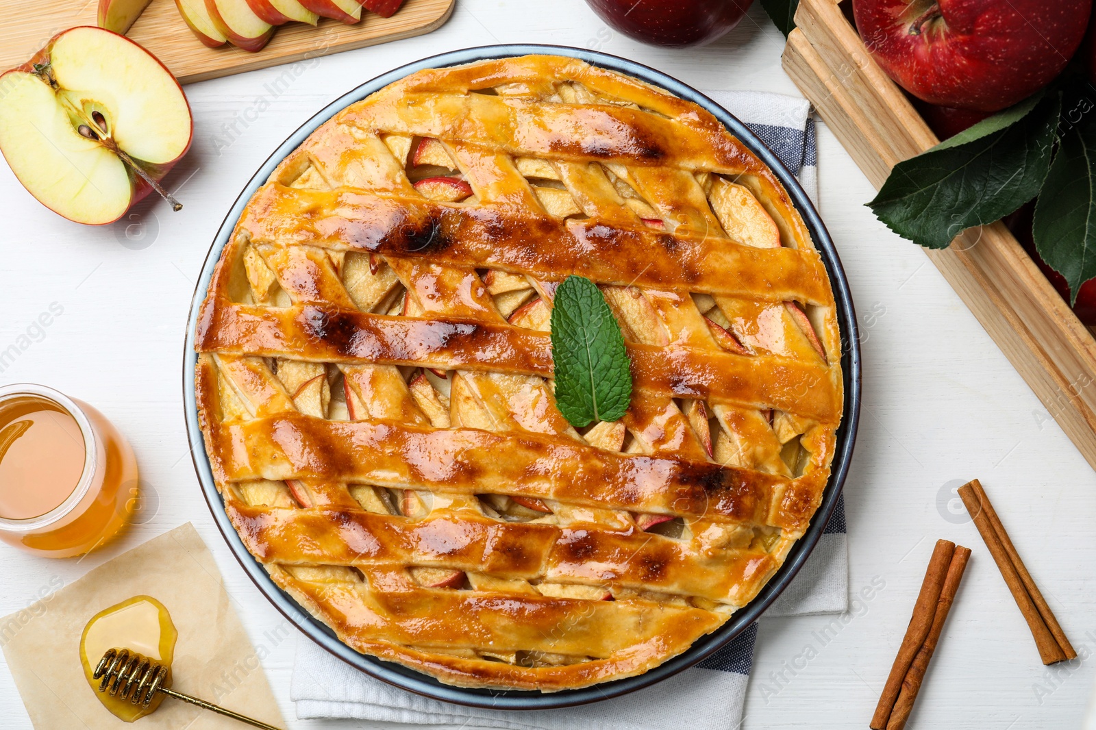 Photo of Flat lay composition with fresh traditional apple pie on white table