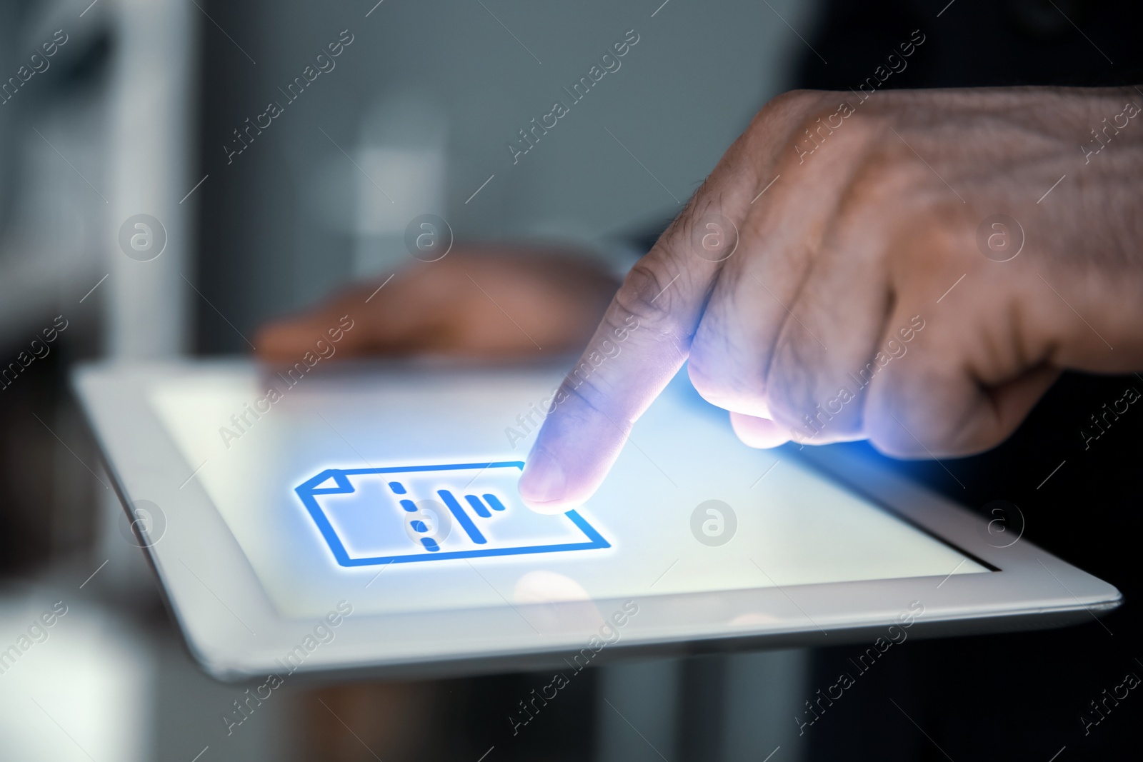 Image of Man clicking on document icon using tablet, closeup