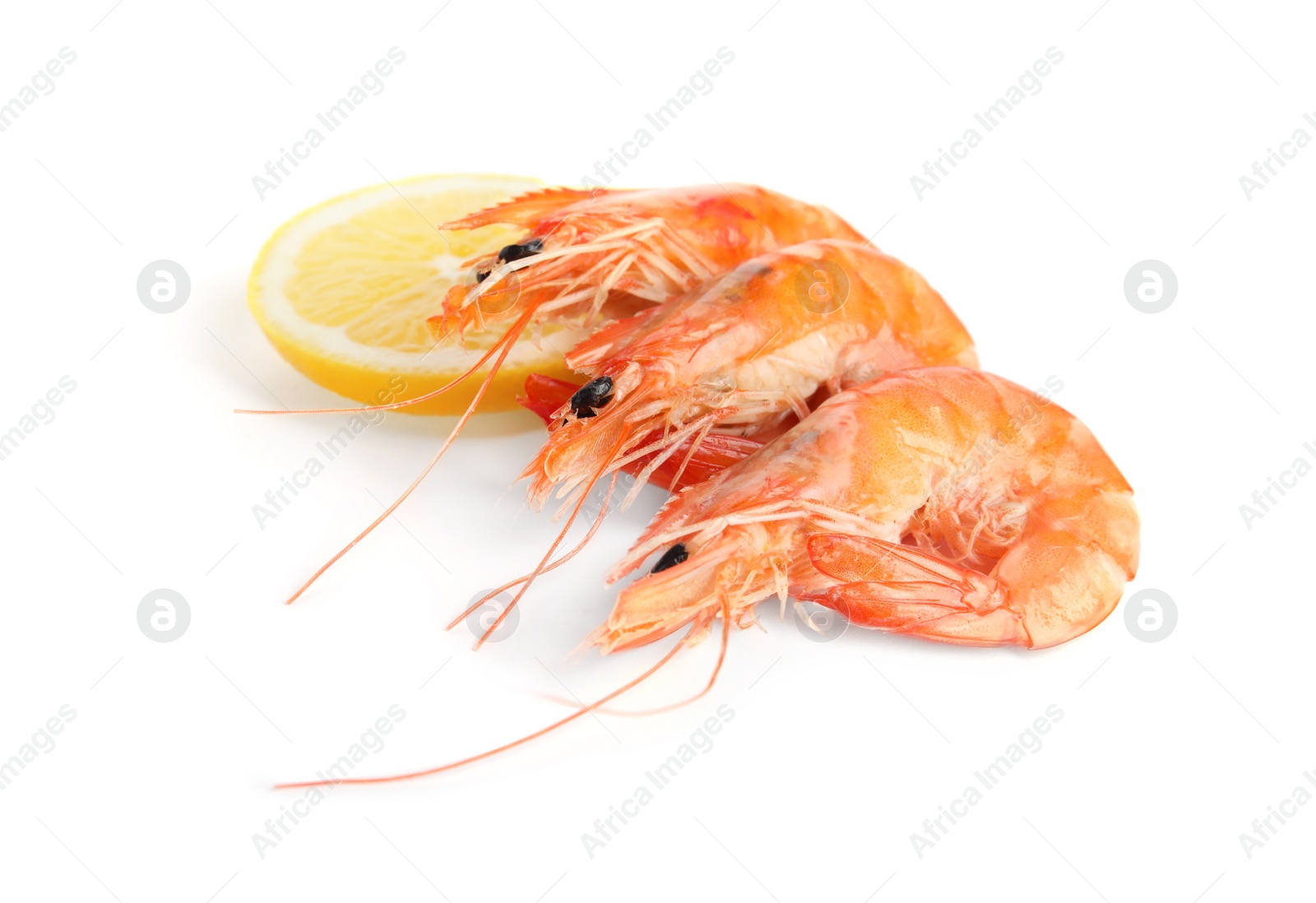 Photo of Delicious cooked shrimps and lemon isolated on white