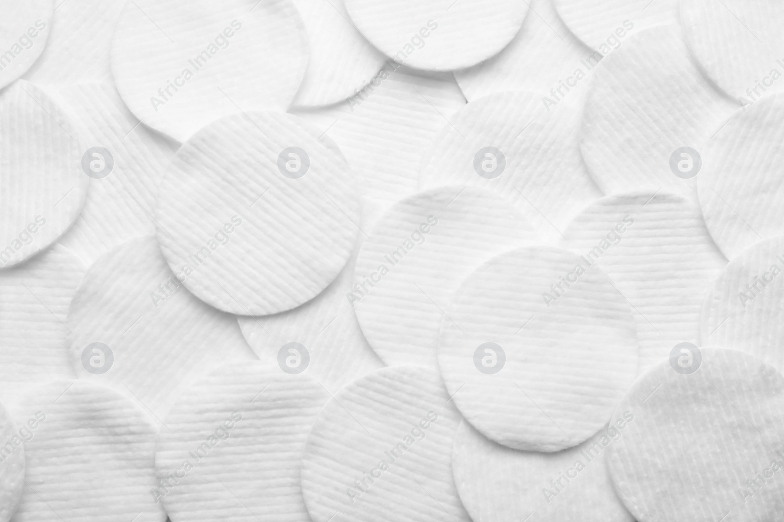 Photo of Soft clean white cotton pads as background, top view