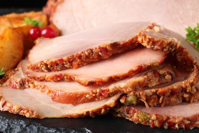 Photo of Delicious ham on slate plate, closeup view