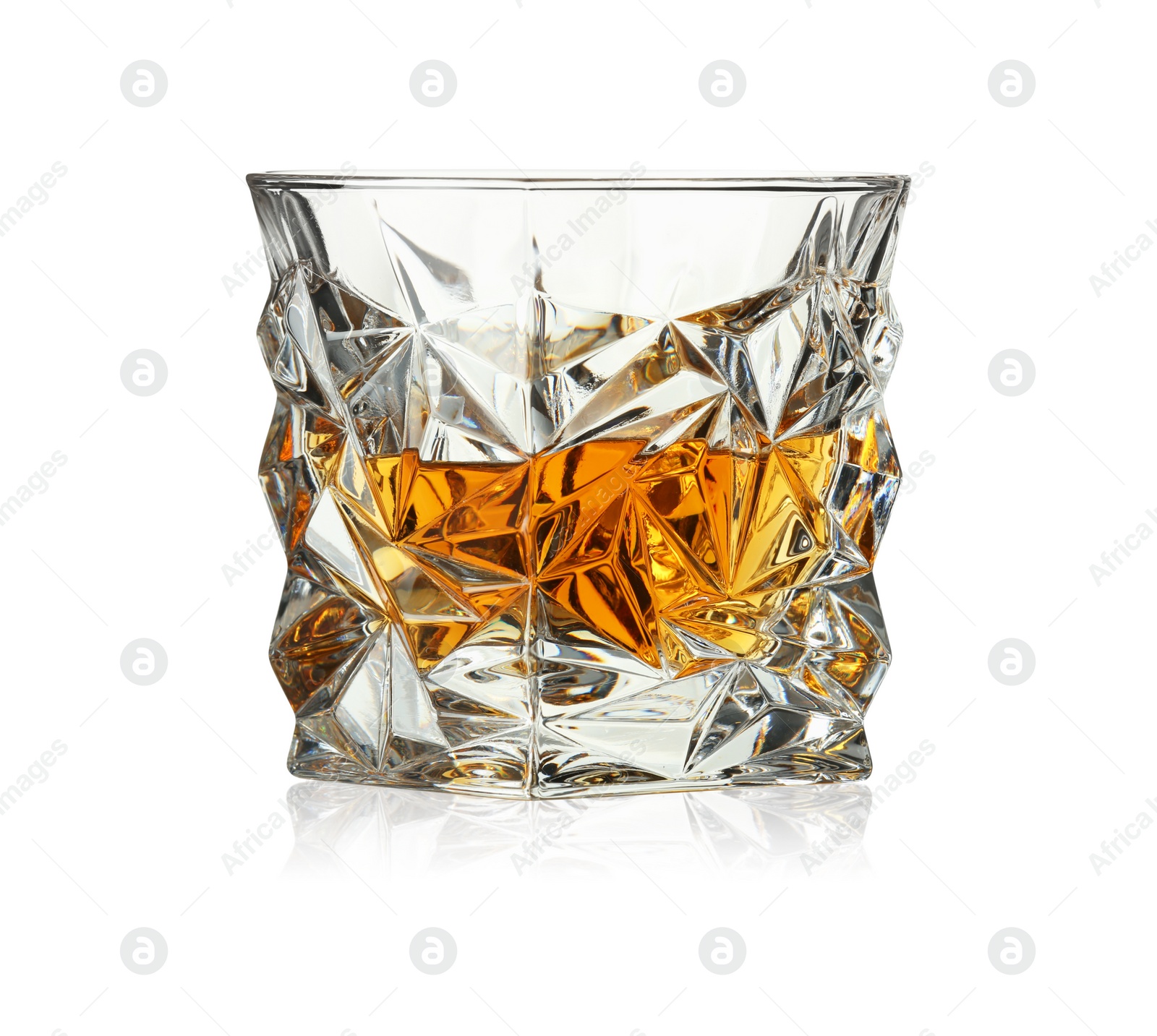 Photo of Whiskey in glass isolated on white. Alcoholic drink