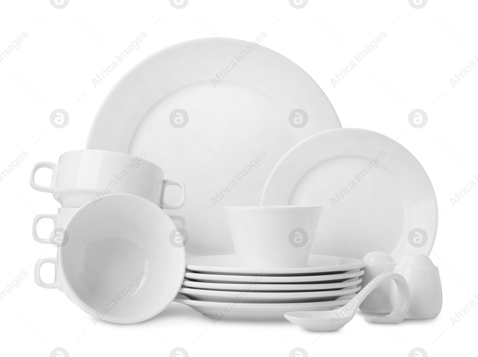 Photo of Set of clean dishware isolated on white