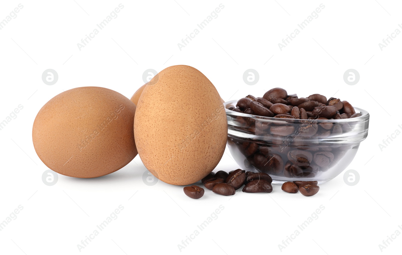 Photo of Easter eggs painted with natural dye and coffee beans on white background