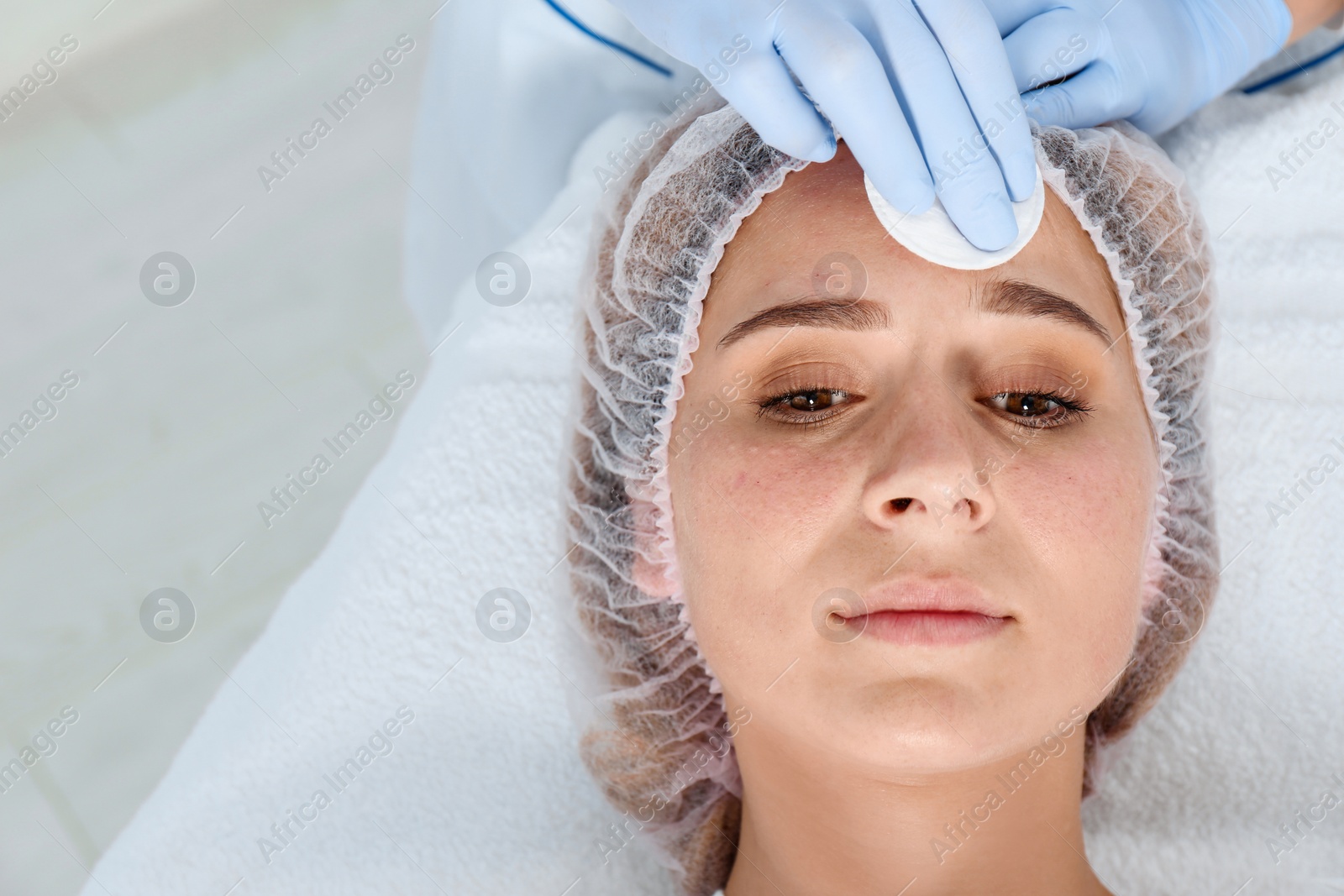 Photo of Woman undergoing face biorevitalization procedure in salon, closeup. Cosmetic treatment