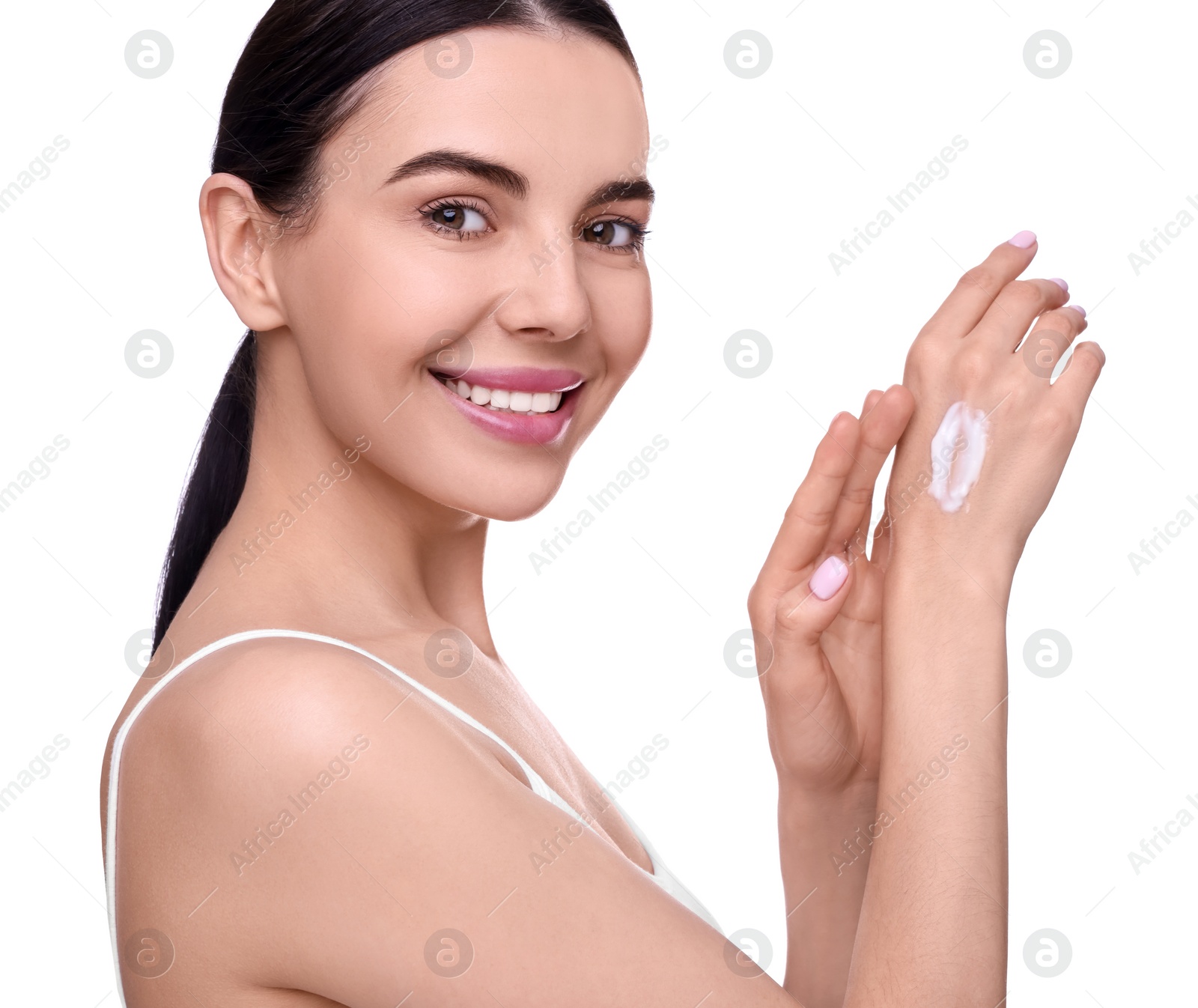 Photo of Beautiful woman with smear of body cream on her hand against white background