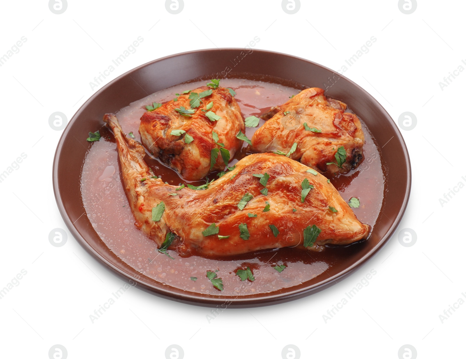 Photo of Tasty cooked rabbit meat with sauce and parsley isolated on white