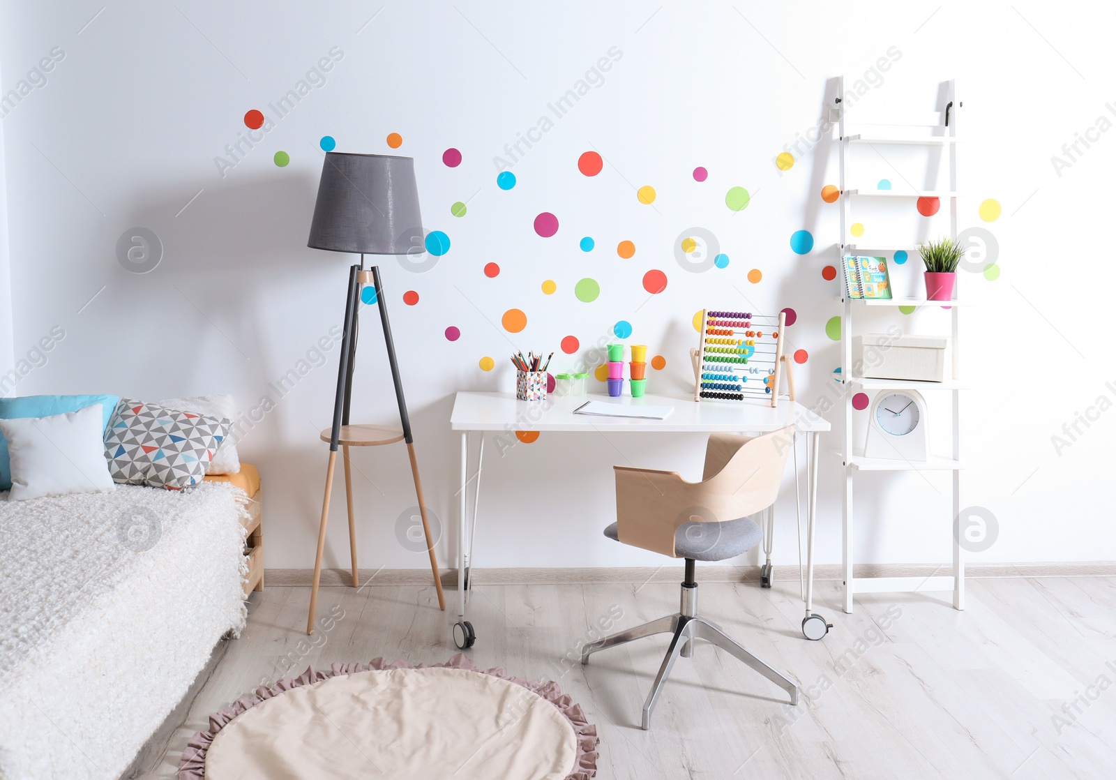 Photo of Modern child room interior with desk and bed