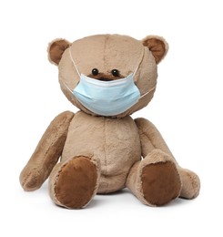Photo of Cute teddy bear with medical mask isolated on white