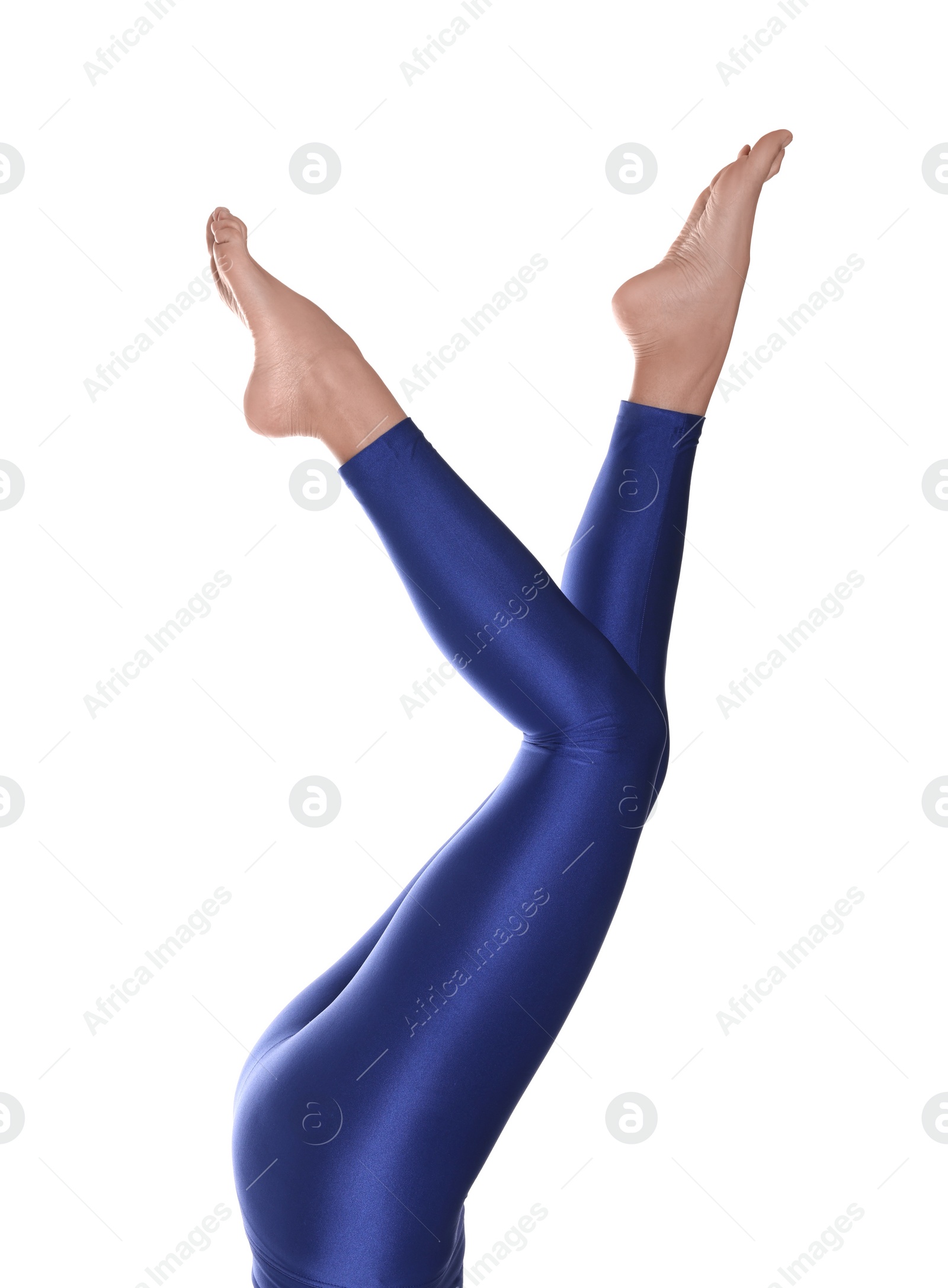 Photo of Woman with beautiful long legs wearing blue leggings on white background, closeup